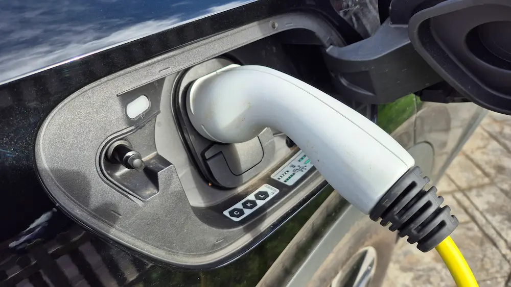 Electric car plugged into home EV charger in Banbury