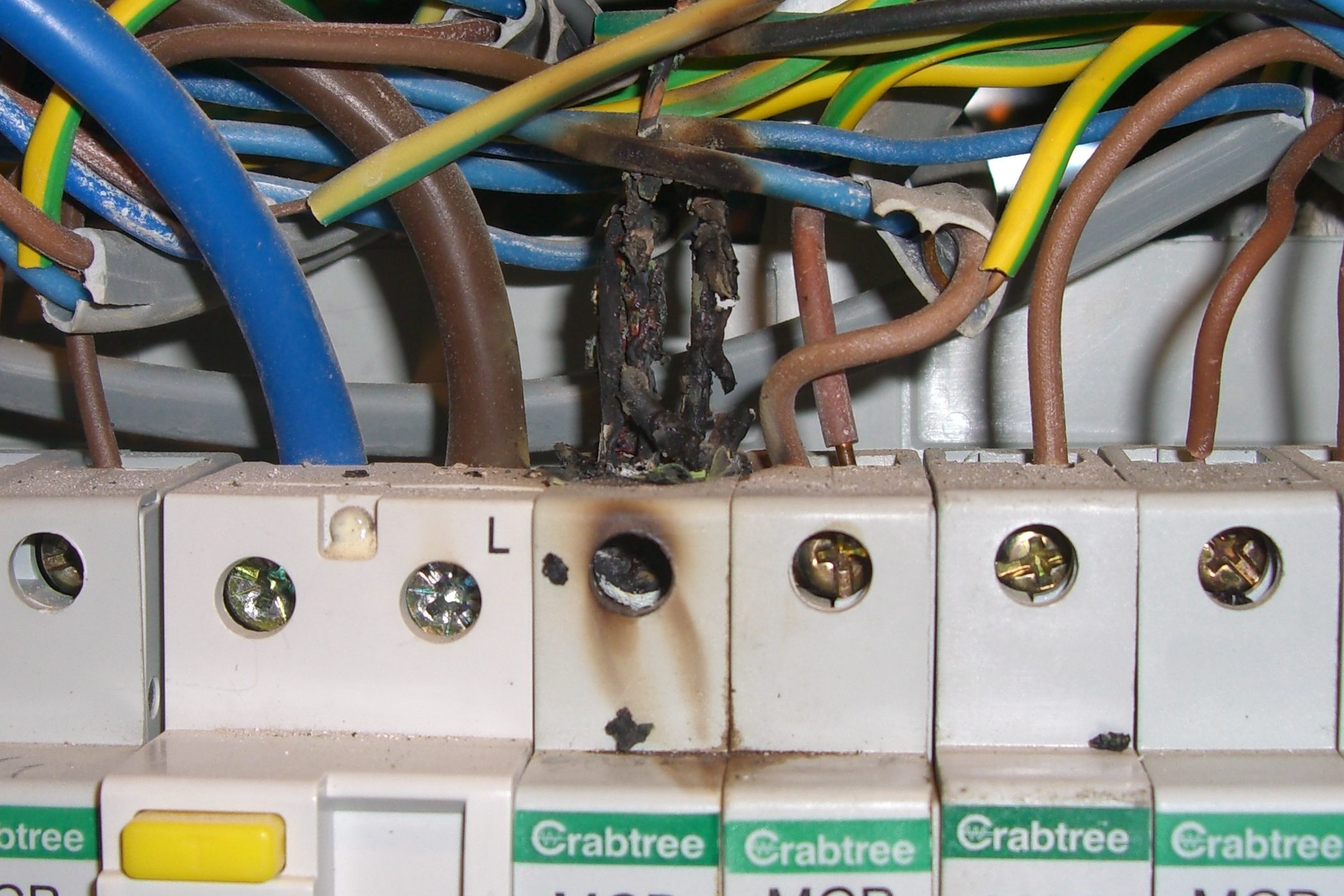 Burnt connection in consumer unit caused by loose terminal in Banbury home