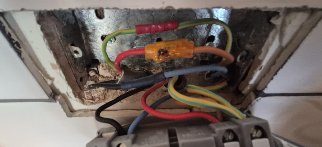 Burnt electrical connection behind socket due to loose wiring