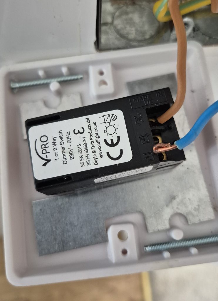 Loose electrical connection behind dimmer switch causing flickering lights