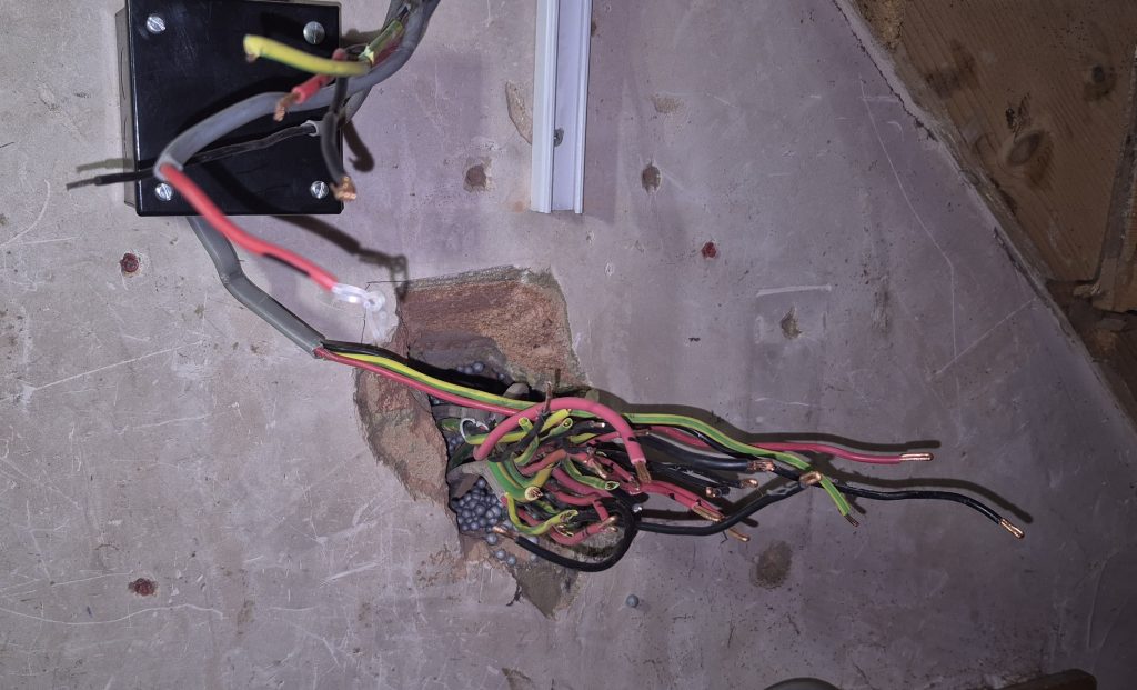 Existing consumer unit removed during upgrade work in Banbury