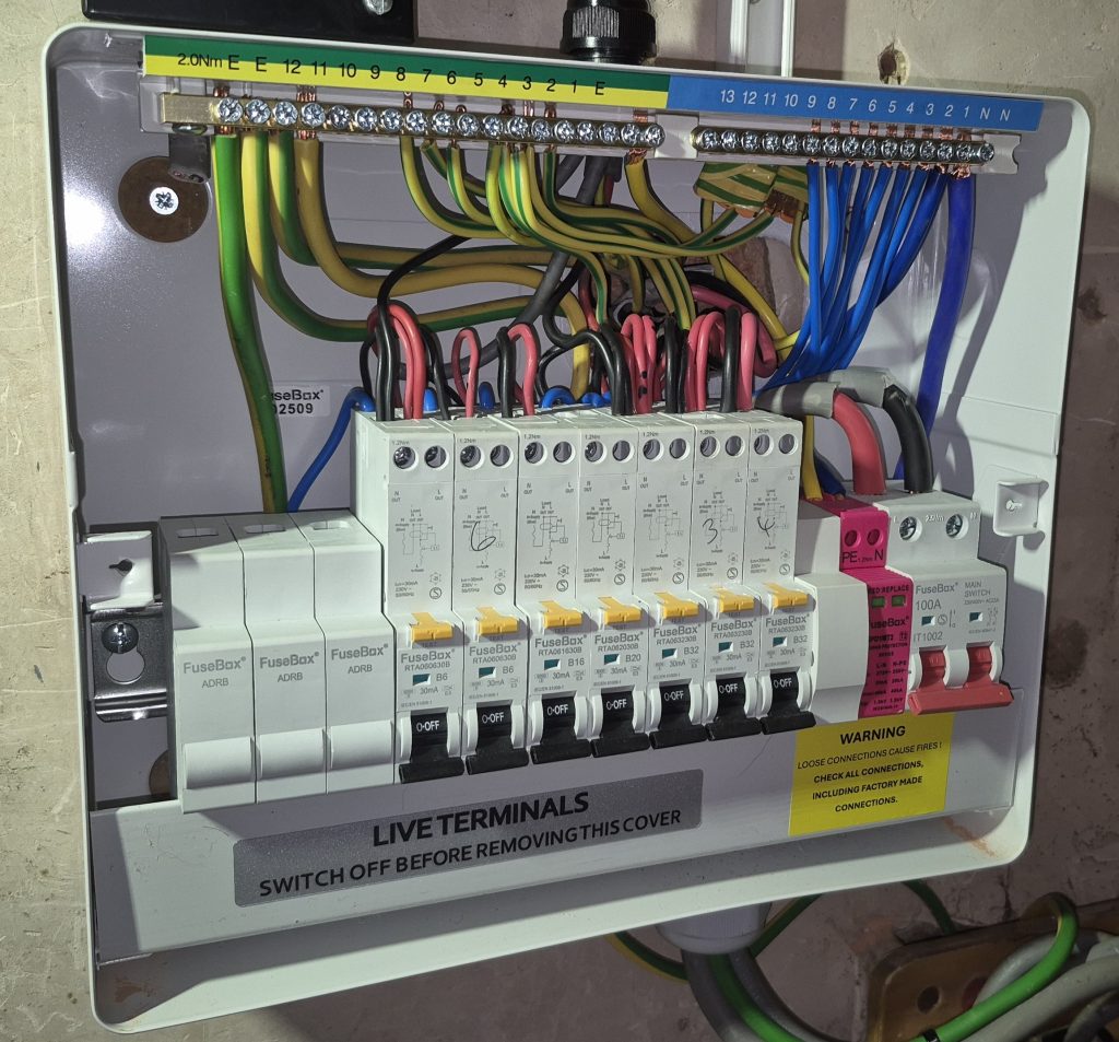 Inside modern FuseBox consumer unit with RCBOs and SPD installed in Banbury
