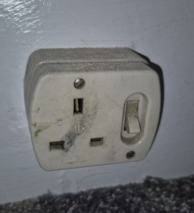 Old faulty electrical socket diagnosed and repaired during fault finding.