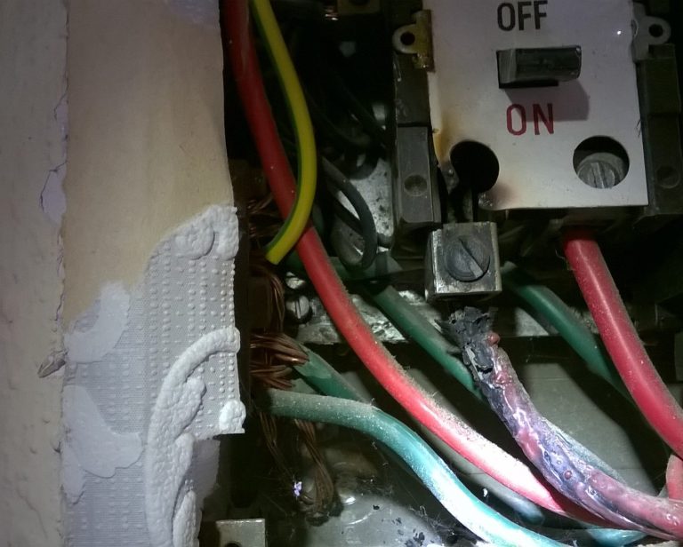 Burnt connection in consumer unit during electrical fault diagnosis