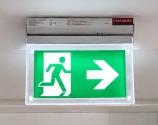 Emergency exit sign above a doorway