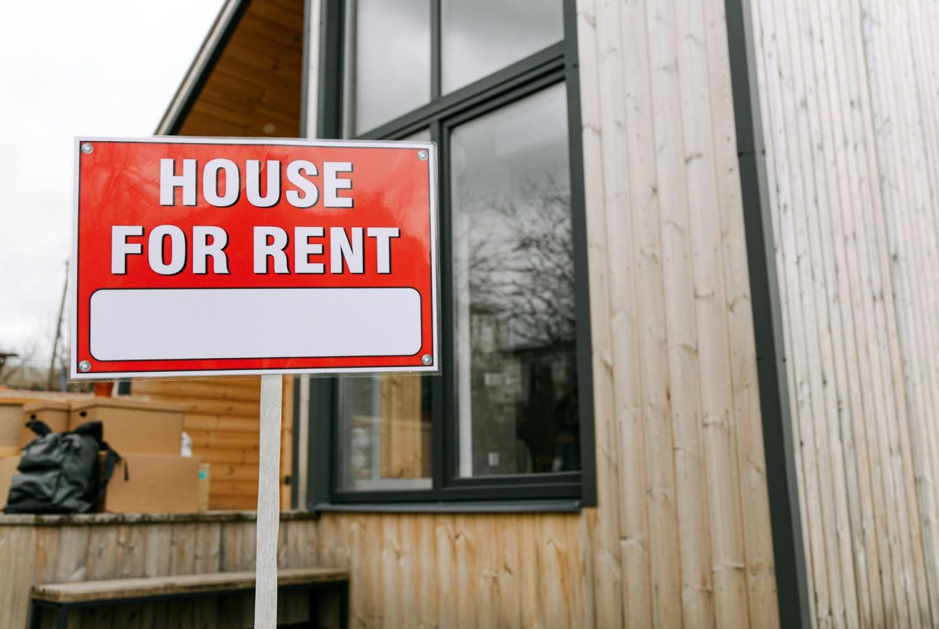 For rent sign outside rental property that will require landlord electrical safety checks.