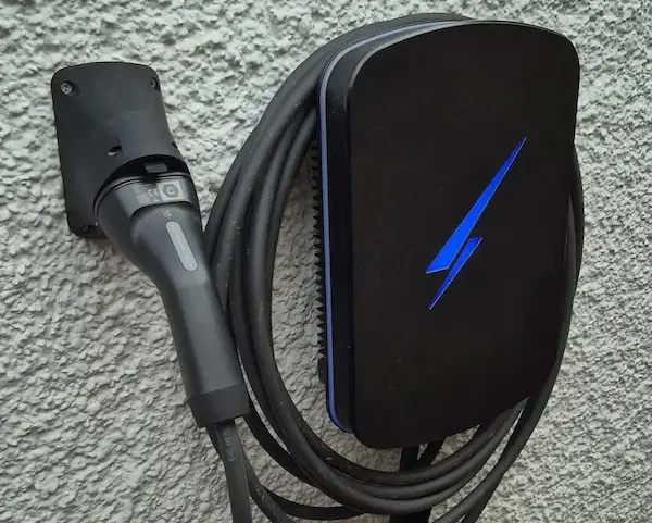 Tethered EV charger installed on an outside wall near Banbury