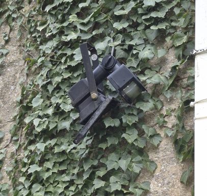 Floodlight detached and hanging by cable discovered during an EICR in Banbury.