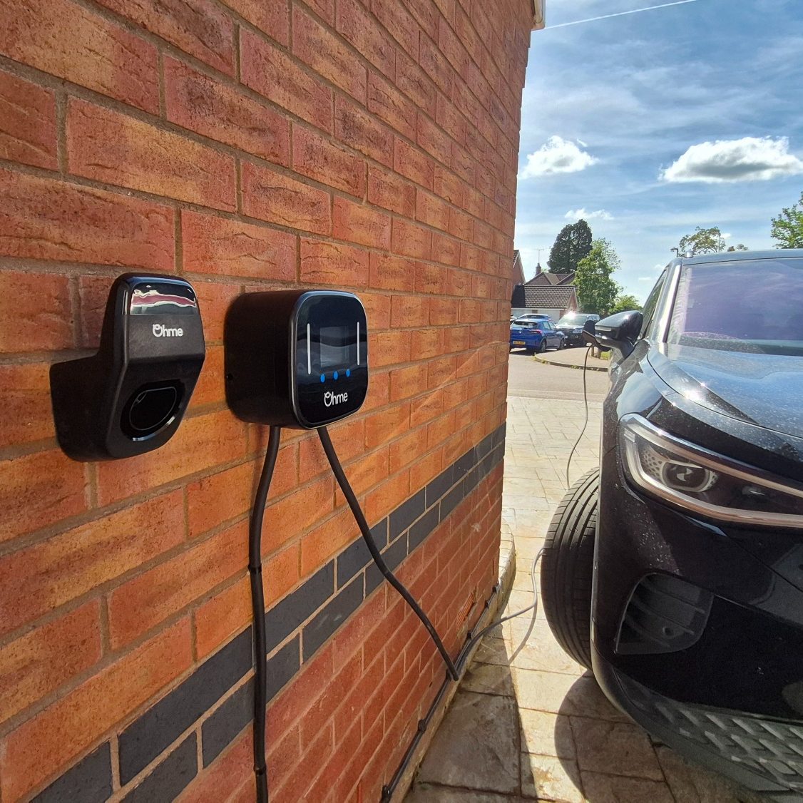 Ohme EV Charger Installation in Adderbury by RW Currion Electrical Ohme EV charger installed and charging Volkswagen ID4 electric vehicle at a home in Adderbury