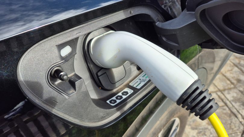 EV charging socket connected to electric vehicle