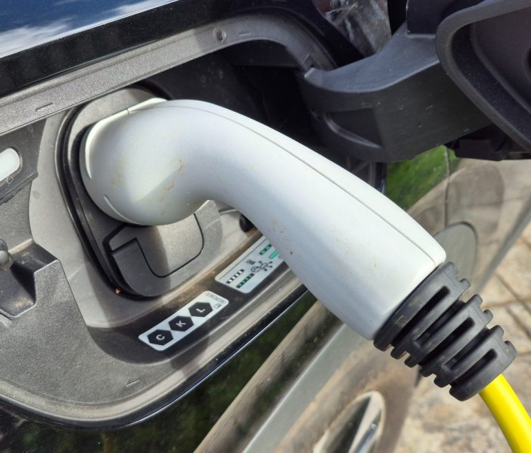 EV charging socket connected to electric vehicle